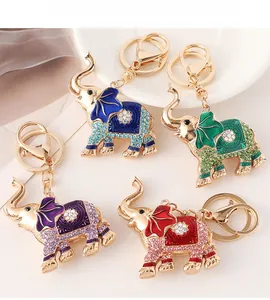 Detail of crystal-studded elephant keychains in blue, green, purple, and pink colors