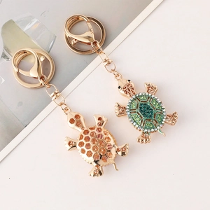 Creative gold sea turtle keychains with sparkling green crystals and lobster clasp set