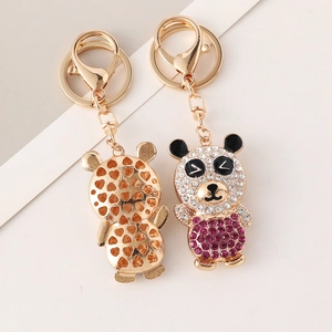 Creative cartoon panda keychain with rhinestones and hollow heart design on back