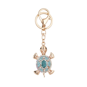 Turtle keychain with rose gold hollow alloy and sparkling blue crystals jewelry style