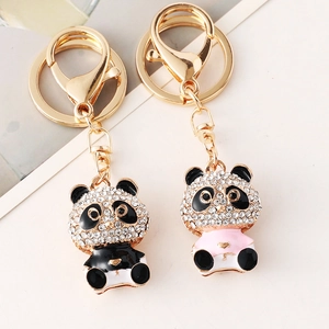 Sparkling panda car keychain with crystal rhinestones in black and pink finishes