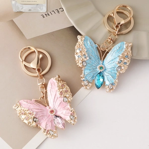 Enamel butterfly keychain and brooch with pink blue stones and pearls on gold plating