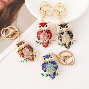 Set of four owl keychains with colorful enamel and sparkling rhinestones in assorted colors