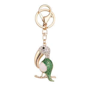 Cartoon toucan bird keychain with green enamel and sparkling rhinestones on gold alloy ring