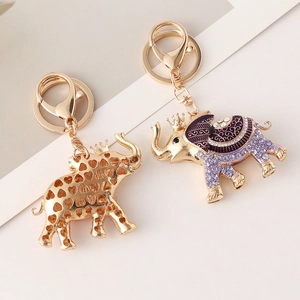 Cute elephant crown keychain with purple enamel and sparkling crystals in gold plating