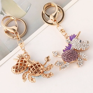 Set portachiavi unicorno scintillante con strass viola e moschettone in metallo dorato lucido