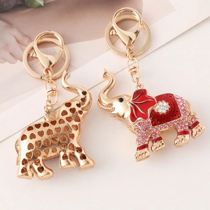 Sparkling elephant keychain set with pink rhinestones and hollow heart metal design