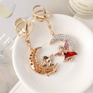 Set di portachiavi creativi con angelo e luna placcati in oro con strass lucidi
