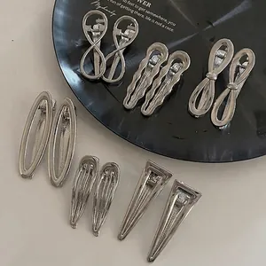 Minimalist silver metal hair clip set with 12 pieces in bow and geometric shapes