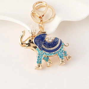 Golden elephant keychain with blue enamel crown and sparkling rhinestones for bags