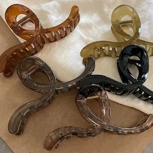 Set of large jelly color acrylic hair claws in amber, green, and tortoiseshell patterns