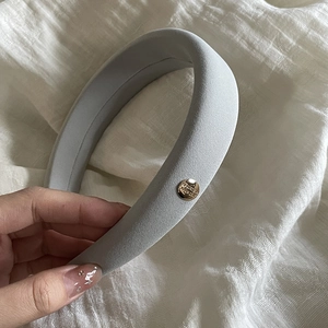 Grey padded sponge headband with vintage gold buckle detail for elevated hair style