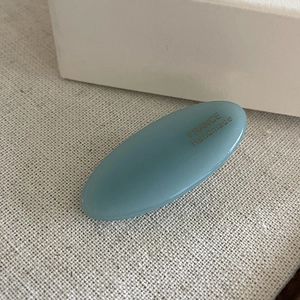Morandi grey-blue acetate oval hair clip with gold France Handmade logo on fabric