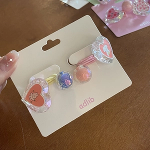 Détails d'élastiques à cheveux en cristal coloré avec mignons motifs de lapin et chien