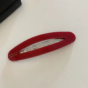 Oval acetate hair clip in deep red resin with gold Barrette La France lettering