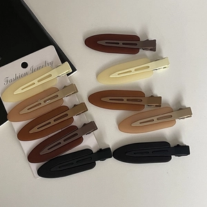 Matte jelly color hair clip set in neutral earth tones on jewelry display card