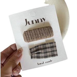 Handmade brown knit and plaid fabric bow hair clips for girls on white card