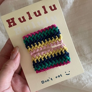 Handmade rainbow crochet hair clips set for women on a white display card