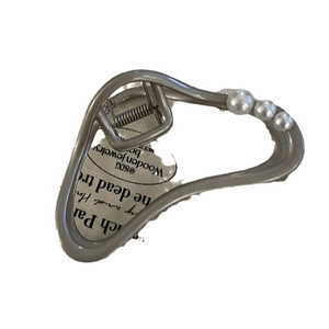 Silver metal shark hair claw clip with elegant pearls for women in a sleek curved design