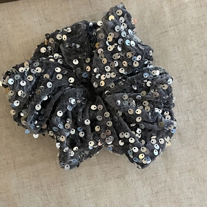 Deep grey sequined scrunchie with sparkling metallic accents on a soft velvet fabric