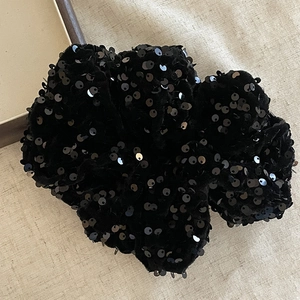 Elegant large black sequin scrunchie made of premium velvet fabric for stylish hair styling
