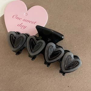 French jelly pink heart hair claw clip for sweet hairstyles on brown paper background