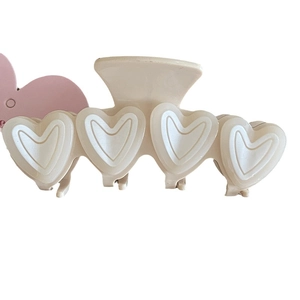 French jelly pink heart claw clip in creamy white finish for elegant hair styling
