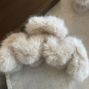 Faux fur hair claw clip in beige plush material for autumn winter elegant hair styling