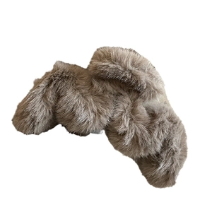 Plush brown faux fur hair claw clip for women featuring a crisscross design on white background