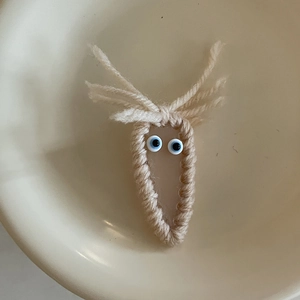 Handmade knitted hair clip with cute cartoon design and blue eyes for girls