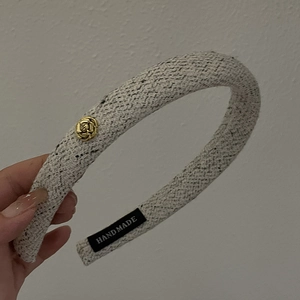 Grey knitted tweed headband with golden metallic rose and handmade label detail