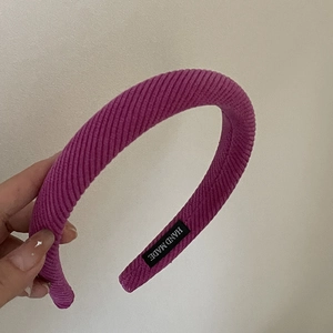 Thick sponge headband in plum pink ribbed knit fabric with handmade interior label