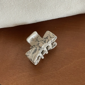 Elegant small acetate hair claw clip with black and white marble pattern for women