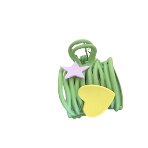 Matte green claw clip with yellow heart and purple star design for ponytail styling