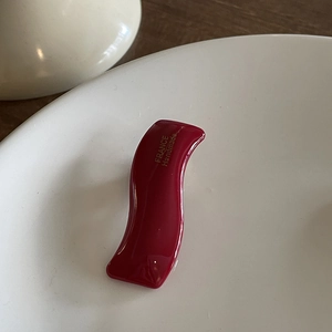 Elegant wave-shaped burgundy hair clip with gold France Handmade lettering on ceramic plate