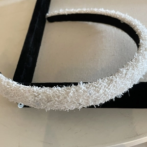 Sparkly sequin white velvet headband with a high crown design for a chic hairstyle
