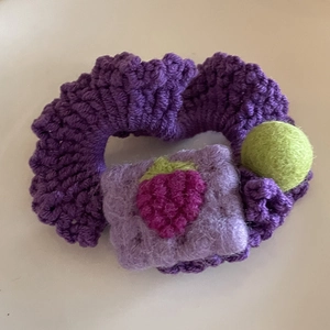 Cute purple knit scrunchie with handmade crochet berry design and green felt ball