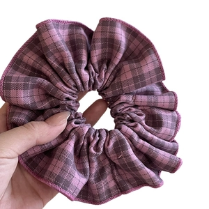 Plaid purple and pink scrunchie made of soft fabric for ponytail hairstyles