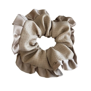 Retro champagne plaid scrunchie with layered fabric texture and wavy ruffled trim