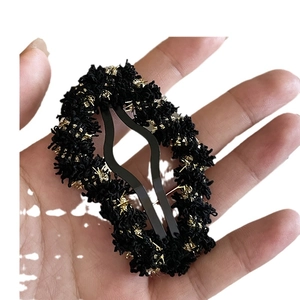 French retro hollow woolen cloud hair clip in black tweed fabric with golden metallic silk