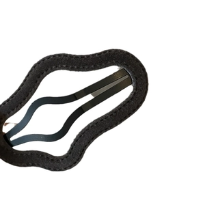 Elegant black flocked wavy cloud hair clip with premium stitching on a white background