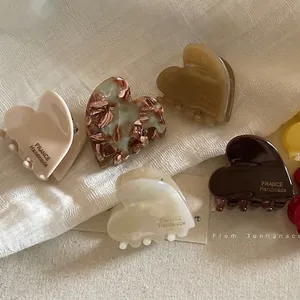French style heart shaped acetate hair claws set in five different elegant marble colors