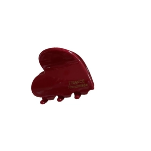 Handmade French red heart acetate hair claw clip with golden lettering on white background