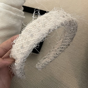 Elegant white sequin tweed headband with fringed edges for a vintage retro hair style