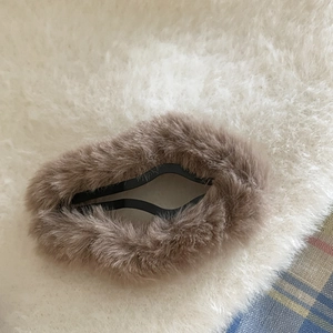 Soft plush cloud hair clip in light brown faux fur for elegant autumn winter hair styling