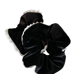 Elegant black velvet scrunchie with white lace trim and ruffled ballet style design