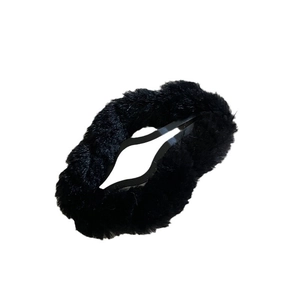 Minimalist black plush cloud hair clip for women with soft faux fur winter texture