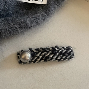 Elegant tweed hair clip with faux pearl detail and black white patterns for women
