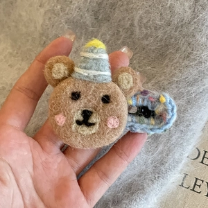 Handmade wool felt brown bear hair clip with party hat and knitted blue ring decoration