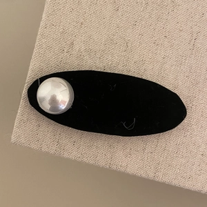 Elegant black flocked hair clip with a large silver pearl accent for autumn and winter styles